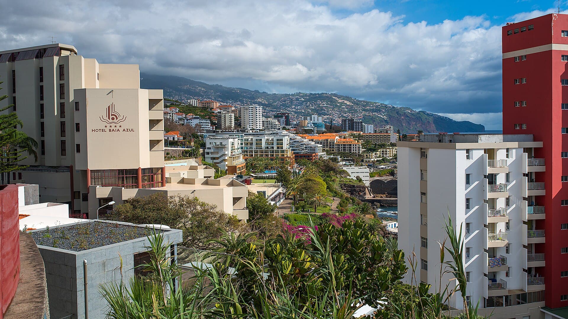 Funchal hotel zone and coast — photo by Bengt Nyman, CC BY 2.0, via Wikimedia Commons