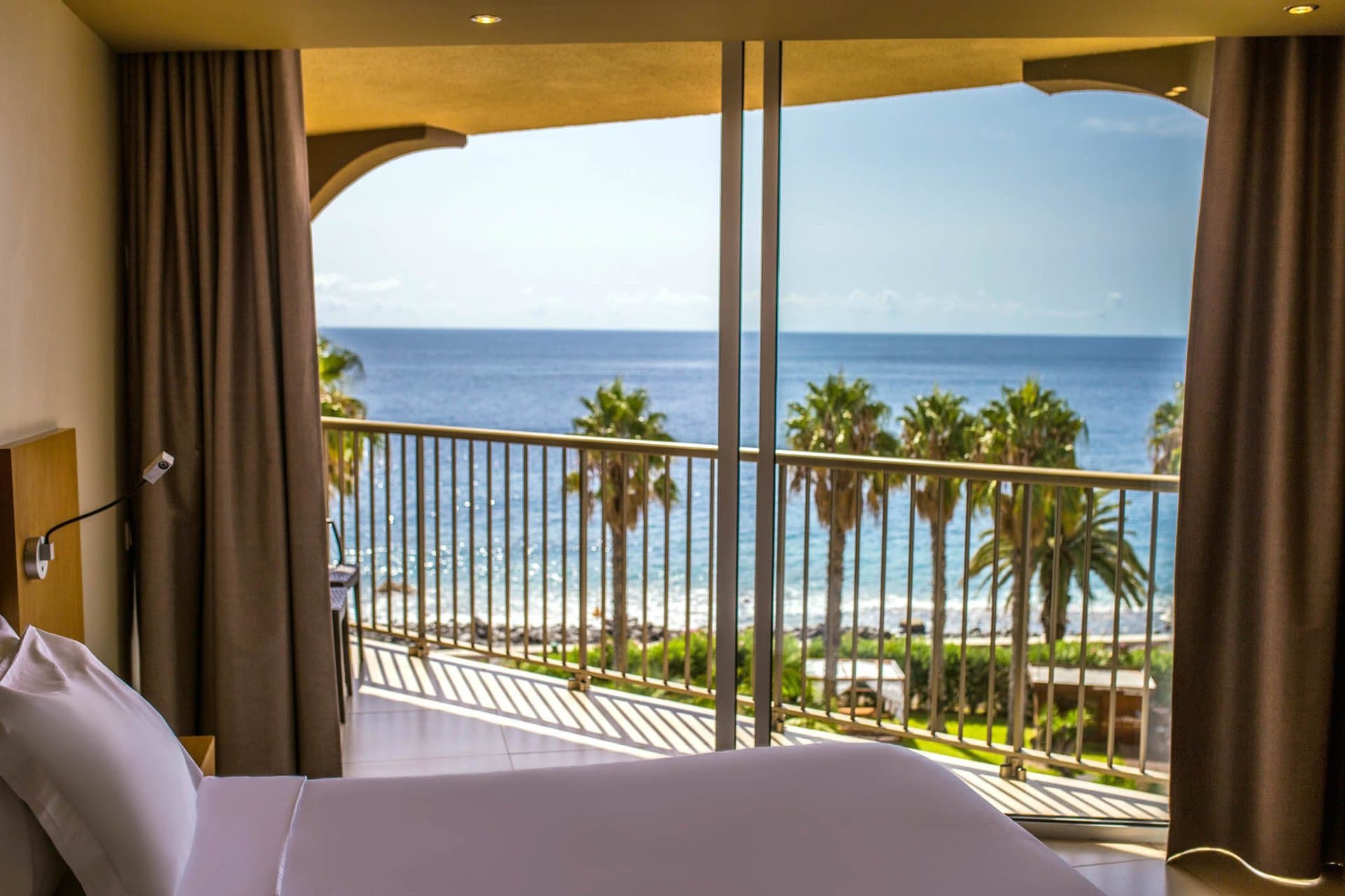 Oasis Caniço — sea-view room balcony over the Atlantic — official photo, https://www.theviewshotels.pt/en/oasis/